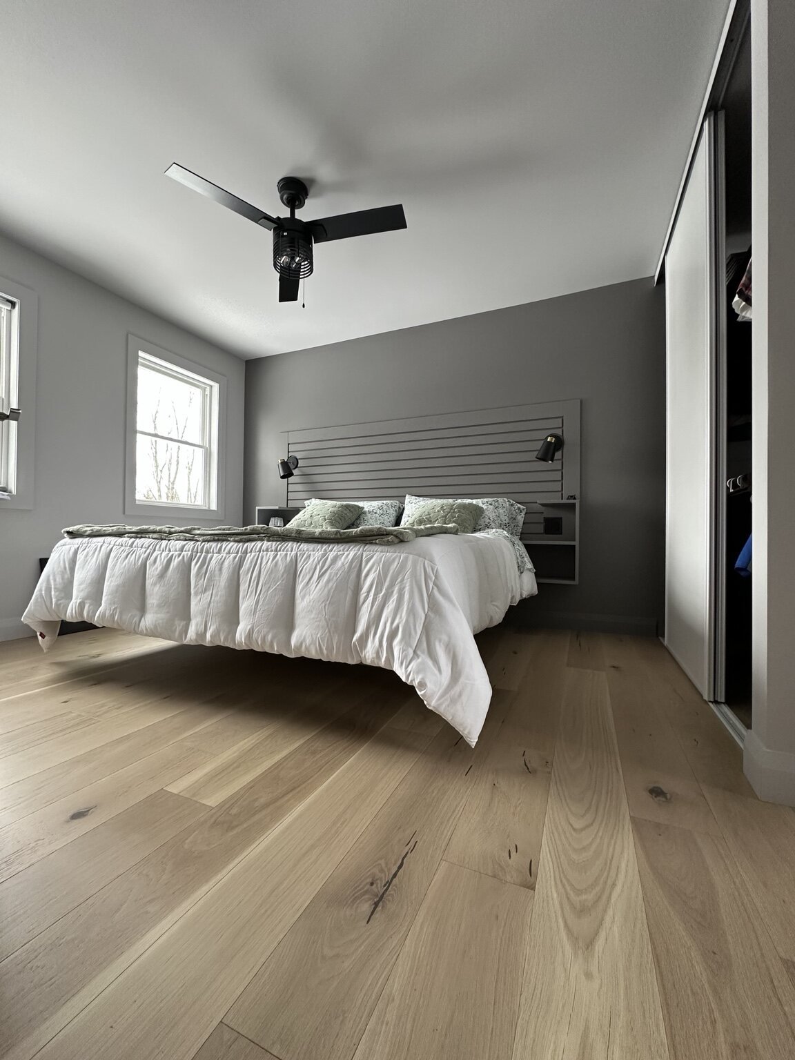 Custom floating bed and integrated headboard